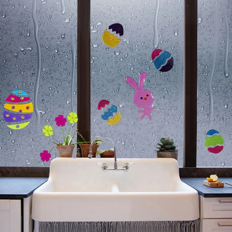 Easter gel clings displayed on a rainy kitchen window for a temporary quote form background